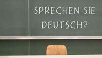 Tafel mit der Aufschrift "Sprechen Sie Deutsch?"