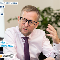 Porträtfoto mit Quote Stefan Rauber